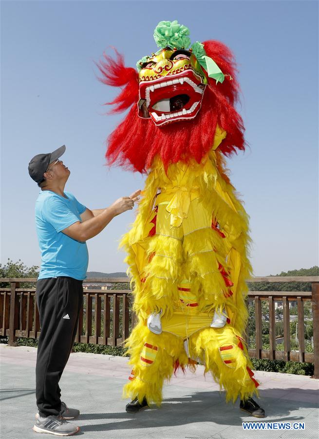 Title: Reviving the Enchanting Beauty of Chinese Lion Dance Embroidered Textiles